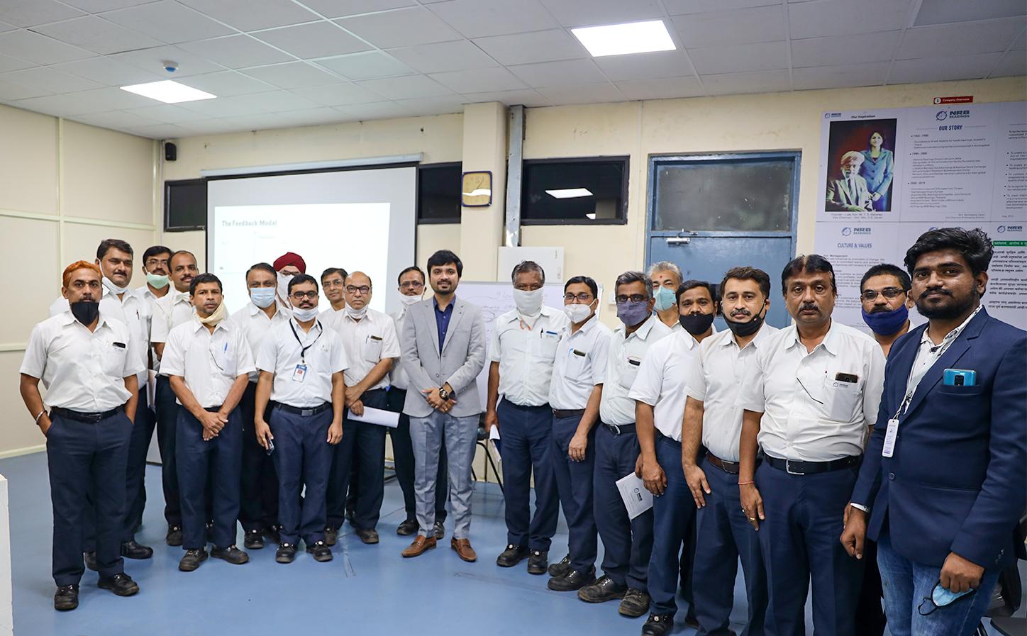 Avinash Chate with a group of corporate employees in a training session.